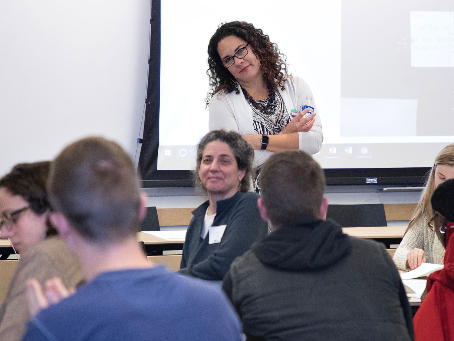 Dr. Ralina Joseph smiling in front of an Interrupting Privilege class